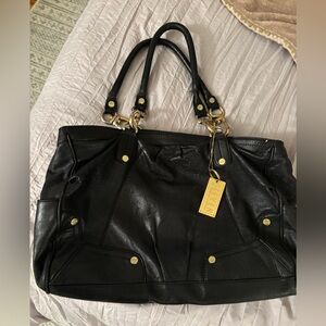 Black leather Steven by Steve Madden bag with cheetah interior and gold details